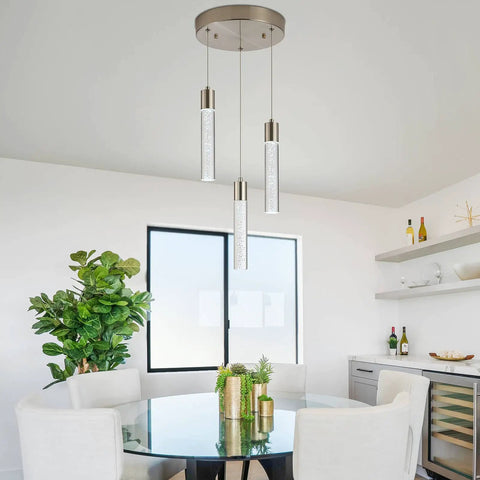 Dining room with Three Light Pendant Fixture In Sleek Silver Finish, showcasing modern dimmable integrated pendant lights.