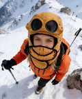 Person wearing Winter Hat With Thermal Barrier And Fleece Lining, Insulated Bonnet With Detachable Eye Shield in snow landscape