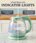 Elite Gourmet Mint Glass Electric Kettle 1L BPA-Free Fast Boil Cordless With Auto Shut Off showing blue LED indicators.