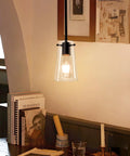 BESTWEST 3 Pack Pendant Lights Kitchen Island, clear glass pendant light hanging above table in matte black finish.