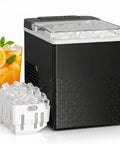Compact Countertop Ice Maker With One Touch Auto Clean System That Skips The Grunt Work Cools Down Fast And Spits Out Crisp Crystal Clear Ice, black finish with ice basket and drink.