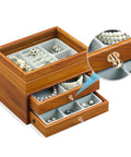 Slick 50 Pack Mini Round Knobs In Sweet Black Zinc Alloy on a jewelry box for stylish organization and updates.