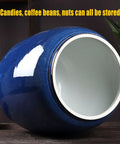 Heavyweight Ceramic Pantry Canister With Secure Snap Lid, Keeps Rice Coffee Beans Flour And Treats Fresh All Week Long, showing blue glazed exterior.