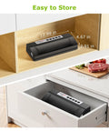 Powerful Vacuum Sealer For Food With Automatic Mode, compact design shown in kitchen storage space, Black Silver unit