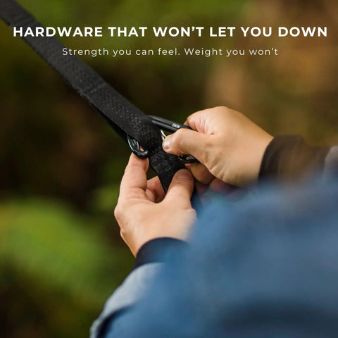 Person attaching 5kN carabiner to tree strap for All In One Camping Hammock Kit With Bug Net And Rain Fly For Easy Setup