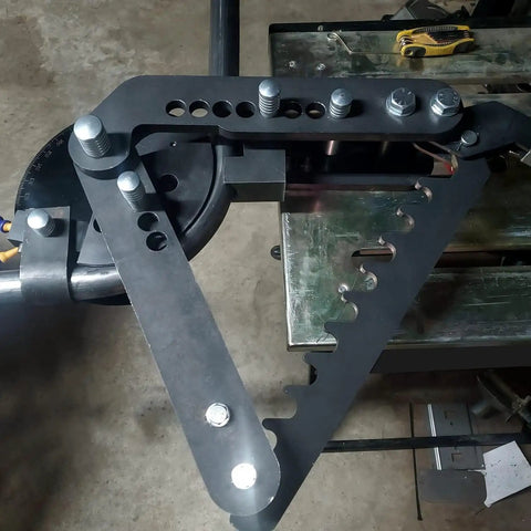 Close-up of Premium Black Oxide Steel Manual Tube And Pipe Bender For Round Square Stock showing adjustable handle and mount.