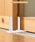 Four Pack Closet Door Floor Guides for Floor Sliding Doors fits one and three eighths inch thick white with eight screws durable ABS material waterproof and wear resistant ideal for cloakrooms bathrooms and kitchens installed on a wooden door.