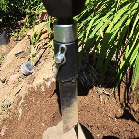 Round Shank Hammers Adapter With Two Slots Drill Bit Shaft Arbor Connector in use with an earth auger on soil