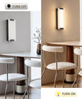 Tipace Hardwired Modern Black LED Wall Sconce Indoor Wall Light Fixture illuminated beside a dining table with chairs.