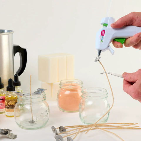 Hands using High Temp Mini Hot Glue Gun Kit With Sticks For Quick Bonds On Paper Metal Plastic Wood Fabric Ceramic And More UL Certified for crafts