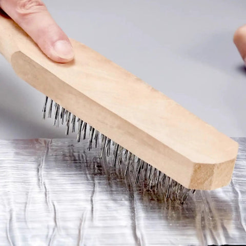 Applying Straight Up Heavy Duty Self Adhesive Bitumen Roof Repair Tape Fo Real with a bristle brush to seal surface.