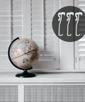 Twelve Pack Transparent Valance Clips For Window Blinds in a modern setting with a globe and white shutters.