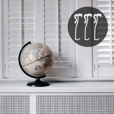 Twelve Pack Transparent Valance Clips For Window Blinds in a modern setting with a globe and white shutters.