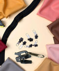 Six Piece Black Universal Zipper Repair Kit With Replacement Teeth And Sliders For Jackets And Bags Easy Install No Brainer Quick Fix Durable Zipper Fasteners Fits Standard Size Zippers For Jackets Bags Backpacks And More displayed with colorful fabrics.