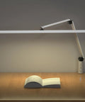 LED Desk Lamp With Clamp And Swing Arm, 31.5 Inch Wide Architect Style Desk Light, 1200 Lumen Brightness illuminating book