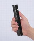 Hand holding Built Tough Heavy Duty Stainless Steel Continuous Folding Hinges Four Pack Black Piano Hinges For Tool Boxes And Solid Wood Cabinets DIY Projects Load Bearing Durable Easy Install