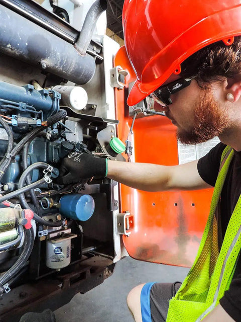 Worker wearing PUG17 Lightweight Polyurethane Dipped Work Gloves Anti Static Puncture Resistant Secure Grip handling machinery