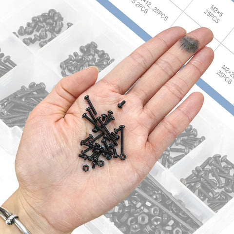 The Real Deal M2 Button Head Socket Cap Screw Assortment Kit 452 Pieces Metric hex screws held in hand, black oxide finish.