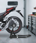 Heavy Duty Rear Swingarm Paddock Stand With Spool Mount, 500 Lb Capacity Wheel Lift For Sport Bikes, Fits Most Models Like Yamaha Honda Kawasaki, Black Powder Coat, Built To Last, supporting a motorcycle in a garage.
