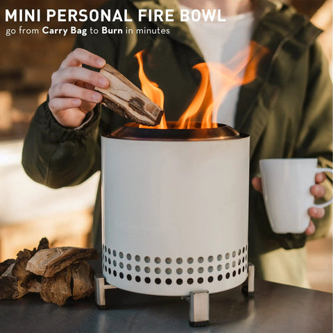 Person lighting Tabletop Smokeless Fire Pit With Stand 7 Inch Stainless Steel Bonfire For Camping And Patio Wood Or Pellet Fueled Portable Fire Pit Lightweight At Only 2.3 Lbs