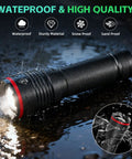 Waterproof Six Pack Rechargeable LED Flashlights With High Lumen Output in rain, black aluminum, close-up of light.