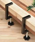 Rock Solid Reversible C Clamp For Woodworking And Plastic Projects 10 To 57mm Wide Adjustable Jaw clamping wood on a workbench.