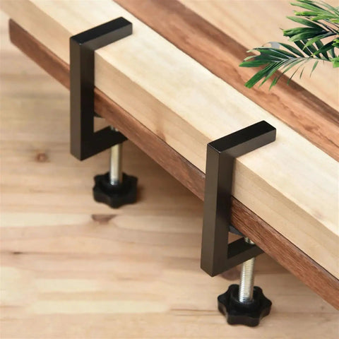 Rock Solid Reversible C Clamp For Woodworking And Plastic Projects 10 To 57mm Wide Adjustable Jaw clamping wood on a workbench.