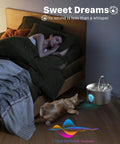 Stainless Steel Cat Water Fountain With 74oz Capacity For Hydration beside sleeping cat and person in dark room.