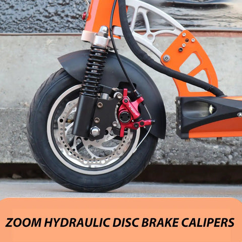 HB 100 Hydraulic Disc Brake Calipers on front wheel of orange electric scooter, red finish, smooth braking on any terrain.
