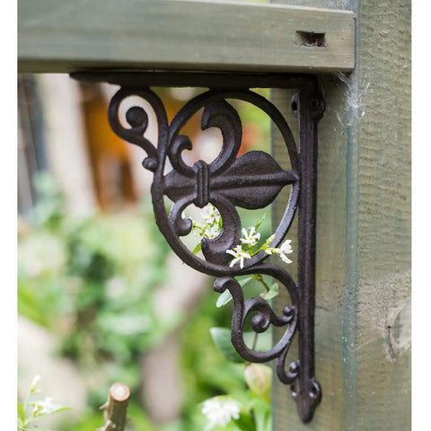 Heavy Duty Iron Corner Braces Tough As Nails Floating Shelf Supports Wall Mounted Triangle Plant Stand Steel L Brackets Set Of Two close-up view of decorative iron corner brace with floral design