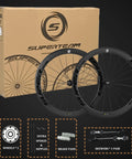 Bangin Carbon Fiber Road Wheelset 700C Rim Brake With 50mm Deep Rim And 25mm Tubeless Ready Design displayed with box and accessories