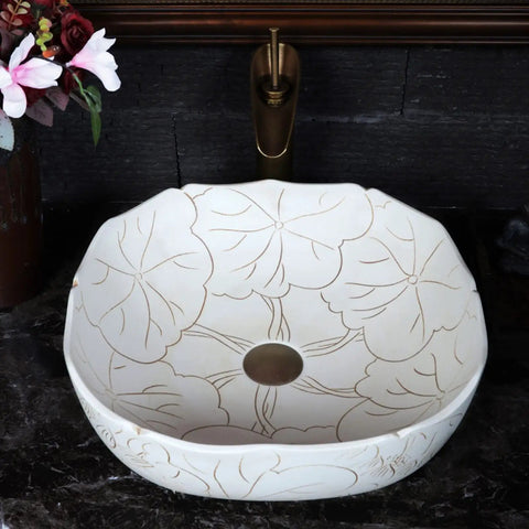 Square Above Counter Bathroom Sink In White Porcelain With Hand Carved Lotus Pattern Grit Proof Surface Easy Peasy Cleaning And A Dope Vintage Vibe That Hits Different On Your Next Vanity Setup, viewed from above with intricate details.