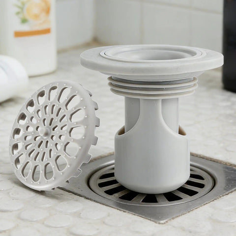 Odor Stopper for Shower - Anti-Odor Mini Bottle Trap Design in gray showing bottle trap and drain cover.