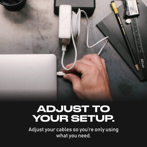 The Side Kick Collapsible Charger Organizer And Travel Accessory For USB C Cords And MacBook And PC Chargers Cable Management White Keeps Cables Tidy On The Go in use with a hand adjusting MacBook cable