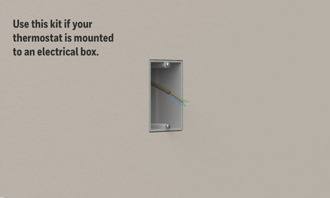 Large Cover Plate And Electrical Box Adaptor For T Series Thermostats on wall with visible wiring