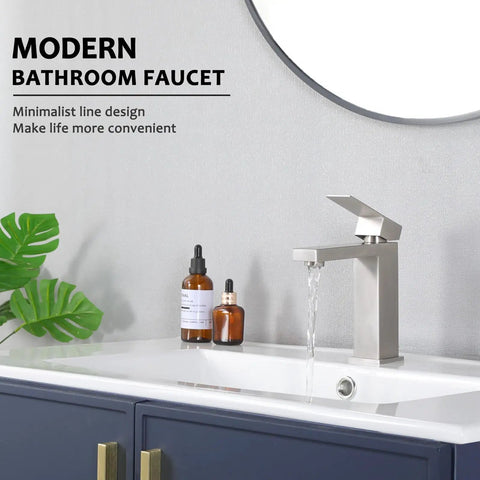Modern bathroom faucet with water flowing, plant decor, and bottles on sink