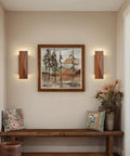 Feasey Set of 2 Walnut Wood Wall Sconce, Vintage Wall Mounted Light Fixture in a hallway setting with art and decor.