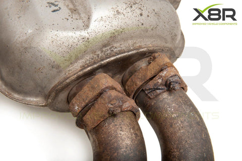 Rusted exhaust pipes showing corrosion on BMW E46 M3, illustrating need for Repair Replacements Fix Kit For Rusted And Corroded Exhaust Flanges