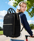 Woman with headphones biking wearing Puffer Backpack On Wheels For Women With Dual Opening Wheeled Laptop Travel Bag Water Resistant Underseat