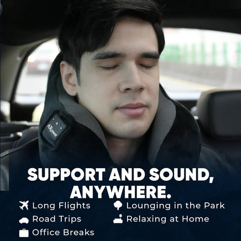 Man using Bluetooth Music Neck Pillow With Built In Speaker For Travel Sleep On Planes Trains Cars And Buses in navy blue