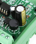 Close-up of an Eight Channel Bidirectional Logic Level Converter Module For 5V 24V Signals with capacitors and optocoupler.