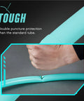 Hand testing toughness of 2 Pack Lightweight 29 Inch TPU Inner Tubes For Mountain Bikes 2.2 To 2.5 With 48mm Presta Valves Metal Core Tubes MTB Ultra Durable High Air Tightness Easy Install Spare Tire Upgrade