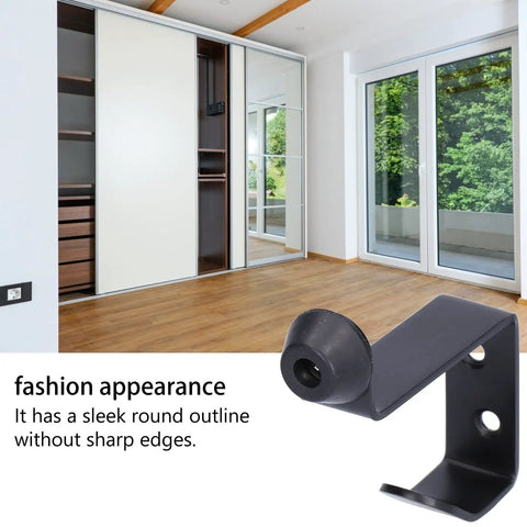 Rock Solid Stainless Steel Door Stopper With Hook, Wall Mounted Door Bumper in black, shown in a modern interior setting