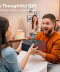 Man receiving a Pro Grade 4K Drone With 3 Axis Gimbal For Adults as a gift during a party celebration.