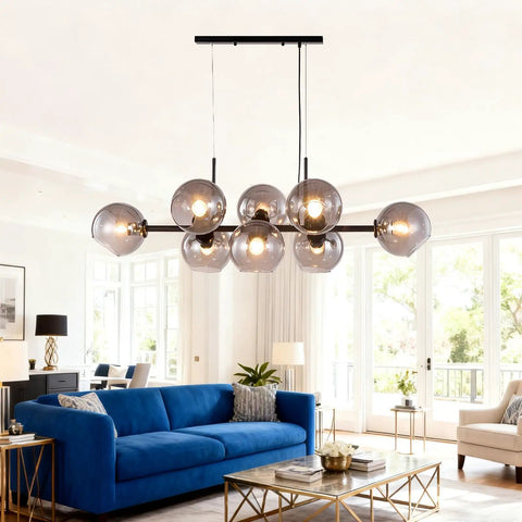 Black Glass Ball LED Pendant Light Transparent Globe Housing Decorative Hanging Fixture Chandelier Ceiling Light in modern living room setting.