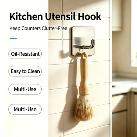 Rock Solid Self Adhesive Wall Hooks Crafted From Premium Stainless Steel For Zero Drill Wall Mounting And Effortless Home Organization With A Smooth Silver Look Set Of Four holding a brush in a kitchen.