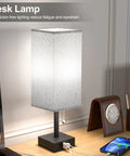 Gray Bedside Lamp With Dual USB Ports USB C And USB A For Nightstand Or Small Desk on a wooden desk with accessories.