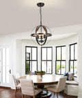 Three Light Vintage Pendant Chandelier In Matte Black With Spherical Shades in dining room