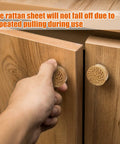 Boho Wood Dresser Drawer Knobs Set Handmade Rattan Woven Cabinet Pulls being installed on wooden cabinet