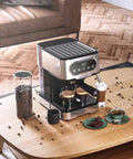 Heavy Duty 20 Bar Coffee Machine With Independent Steam Frother for silky lattes on a wooden table with coffee beans.